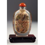 A LARGE CHINESE REVERSE-PAINTED SNUFF BOTTLE AND AGATE STOPPER, together with hardwood stand. Bottle