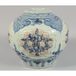 A LARGE CHINESE BLUE AND WHITE PORCELAIN JAR decorated with relief panels of flora and insects,