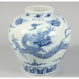 A CHINESE BLUE AND WHITE PORCELAIN JAR painted with a dragon and lion masks, the shoulder with