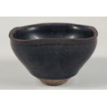 A CHINESE HARE'S FUR GLAZE POTTERY BOWL, 12.5cm at widest point.