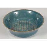 A LARGE CHINESE TURQUOISE GLAZED PORCELAIN BOWL, the interior centre with incised gilt characters.