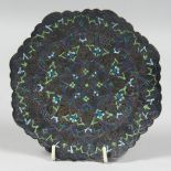 A PERSIAN ENAMELLED SILVER DISH, the embossed and chased dish with foliate enamelled decoration,