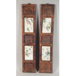 A PAIR OF DOUBLE PANELLED HARDWOOD AND PORCELAIN PLAQUES, the porcelain panels painted with birds