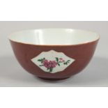 A SMALL CHINESE BROWN GLAZE PORCELAIN BOWL, the exterior with three panels of flowers, 12cm