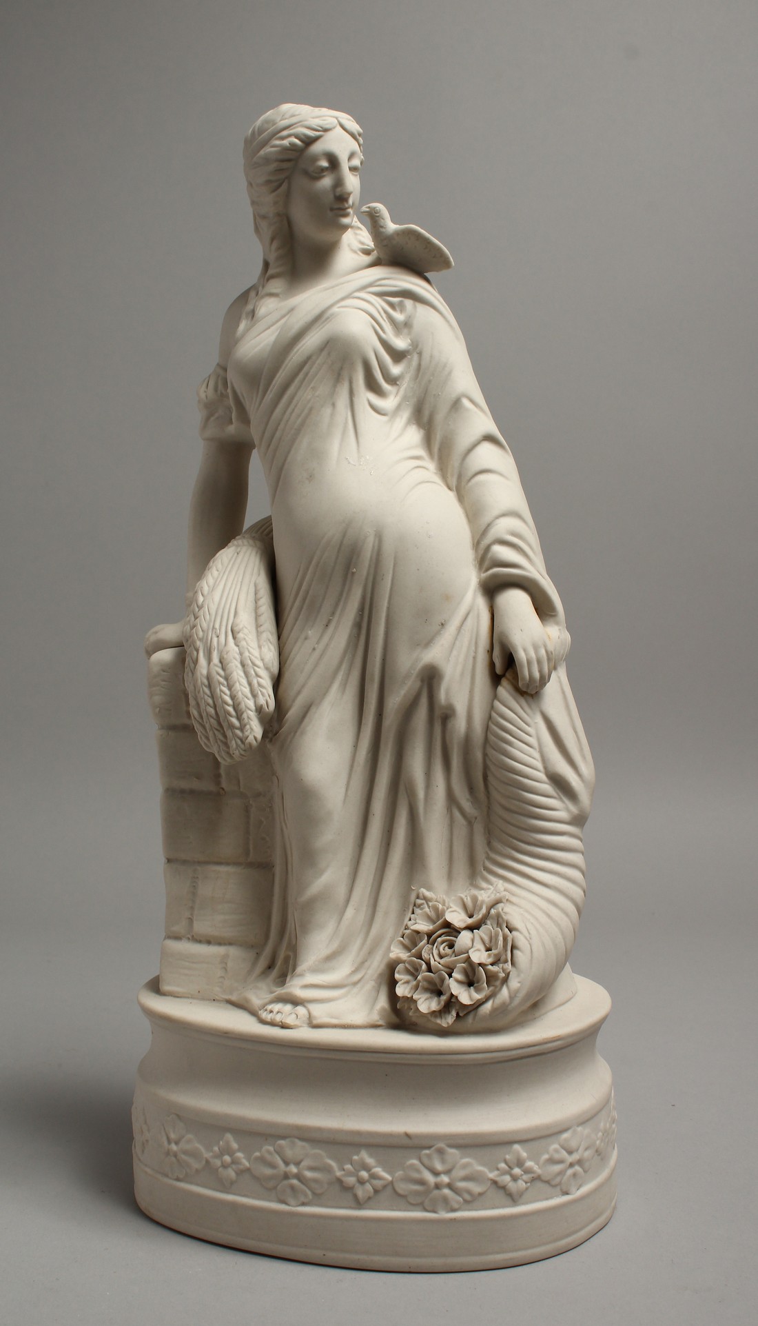 A GOOD PARIAN GROUP, depicting "HARVEST". 13ins high.