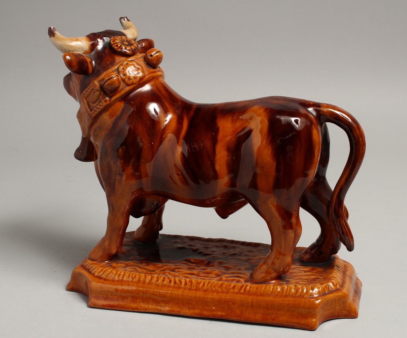 A PORTUGUESE POTTERY BULL on a rectangular base. 10ins long. - Image 2 of 3