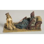 A VIENNA PAINTED BRONZE ARAB AND SLAVE GIRL. 7ins long