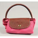 A LONGCHAMP BAG 7ins x 3.5ins with two handles