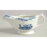 AN 18TH CENTURY LOWESTOFT FINE SMALL SAUCE BOAT with a pleat moulded body and moulded cartouches