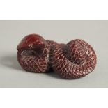 A CARVED WOOD NETSUKE SNAKES. 2ins