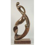 A LARGE ABSTRACT BRONZE OF TWO ENTWINED FIGURES. 2ft 11ins high.