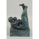 AFTER HENRY MOORE. MOTHER'S CHILD on a rectangular base. 13ins high.