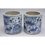 A PAIR OF CHINESE BLUE AND WHITE POTTERY GARDEN JARDINIERES. 1ft 8ins high.