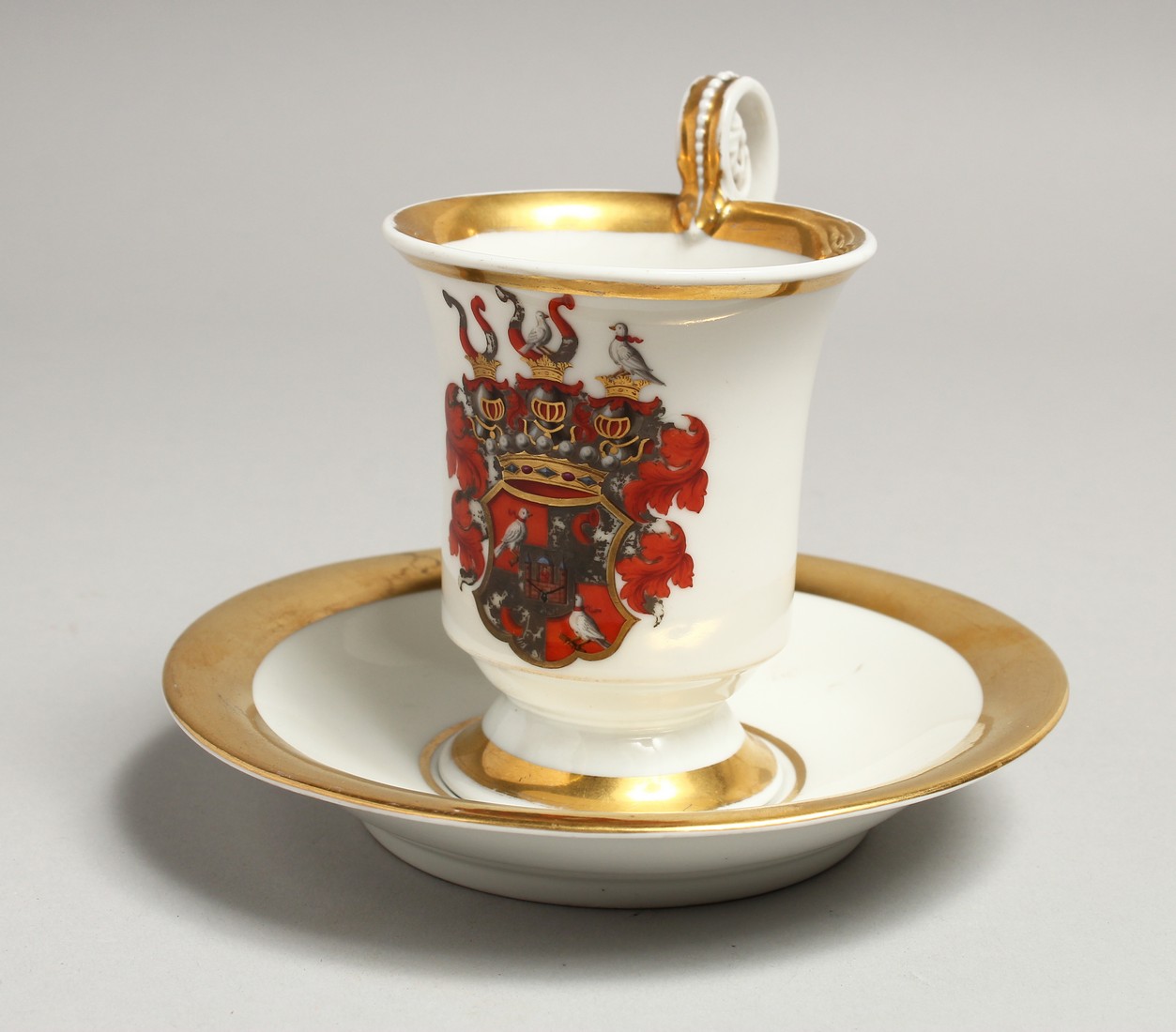 A 19TH CENTURY BERLIN CUP AND SAUCER, white ground edged in gilt. Sceptre mark in blue.