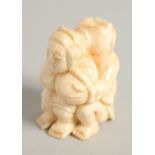 A CARVED BONE NETSUKE. 1.5ins.