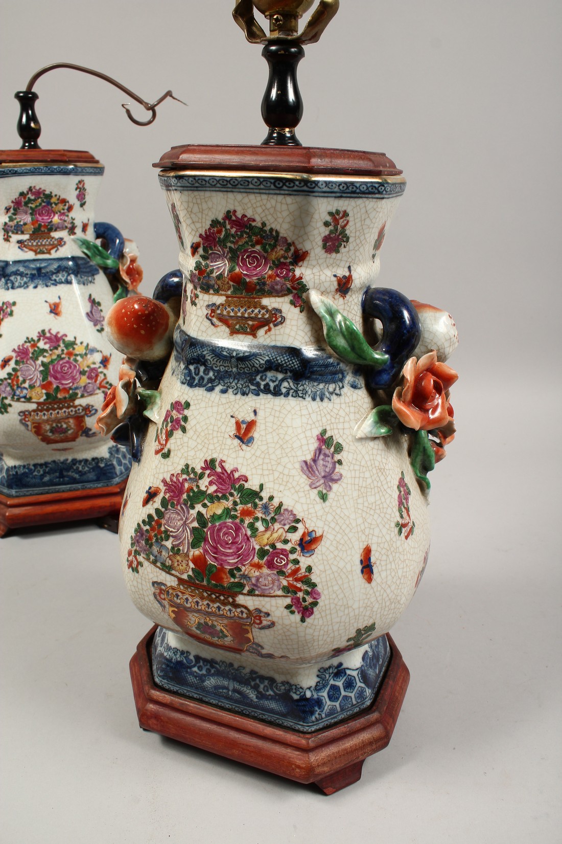 A PAIR OF PORCELAIN LAMPS with fruit handles. 17ins high. - Image 2 of 2