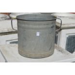 A galvanised twin handled planter.