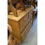 A pine chest of drawers.