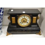 A Victorian mantel clock.