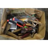 A box of gardening and other tools.