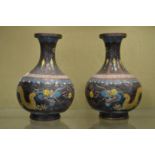 A pair of small cloisonne vases.