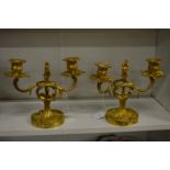 A pair of ormolu twin branch candelabra.