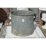 A galvanised twin handled planter.