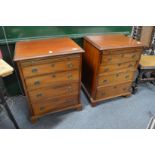 A pair of mahogany small four drawer chests with brushing slide.