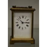 A brass carriage clock.