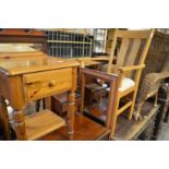 A modern oak armchair, a pine mirror and bedside table.