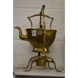 A Victorian brass kettle on stand.