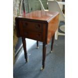 A 19th century mahogany two drawer drop flap worktable.