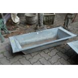 A galvanised garden trough.