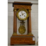 An inlaid rosewood portico mantel clock.