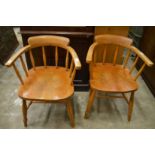 A pair of modern smokers' bow chairs.