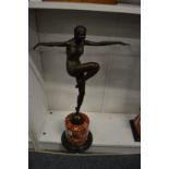 An art deco style bronze figure of a dancer on a marble base.