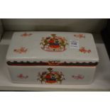 An armorial porcelain box and cover.