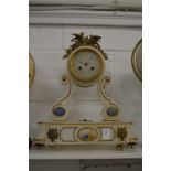 An ornate alabaster mantel clock.