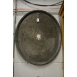 A large Eastern plated oval tray with engraved and pierced decoration.