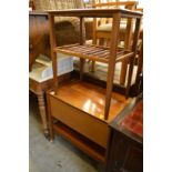 A teak table and drop flap trolley.