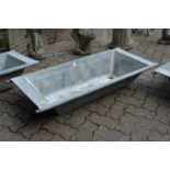 A galvanised garden trough.