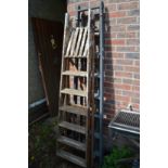 Two wooden step ladders.