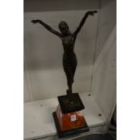 An art deco style bronze figure of a dancer on a marble base.