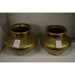 A pair of Indian engraved brass vases.