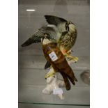 A good porcelain model of two falcons.