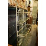 A good large wrought iron and glass five tier display unit.