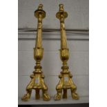 A pair of giltwood alter candlesticks.