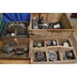 Old storage boxes containing various dials etc.