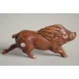 A BONE NETSUKE OF A BOAR. Signed, 2.5ins.