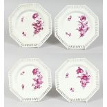 A SET OF FOUR PIERCED OCTAGONAL BERLIN PLATES, flowers in sepia. Sceptre mark, 8ins diameter.